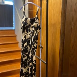 Off shoulder sleeveless floral dress. Blue and white floral pattern. Knee high.